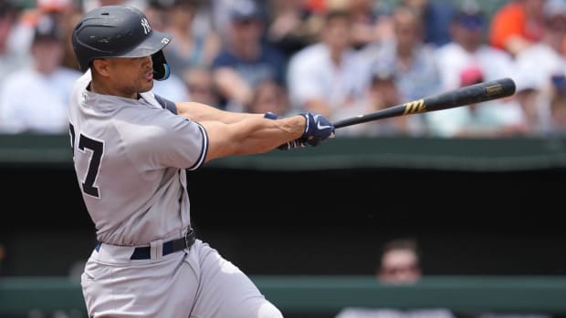 Giancarlo Stanton swings at a pitch.